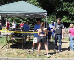 Firecraker 4 Miler in a REALLY HOT day in NJ. Getting my 1st medal and shirt. Apparently I stand like I have a balance problem.